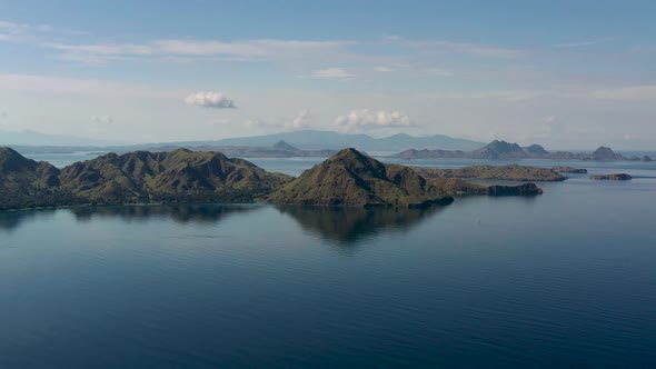 Volcanic landscape remnants of the formation of Komodo Island Indonesia, Aerial pan right panorama v