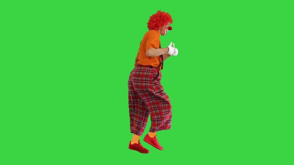 Happy Clown Show Thumbs Up While Walking on a Green Screen Chroma Key