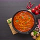 Cooking pasta spaghetti with tomato sauce in cast iron pan  - VideoHive Item for Sale