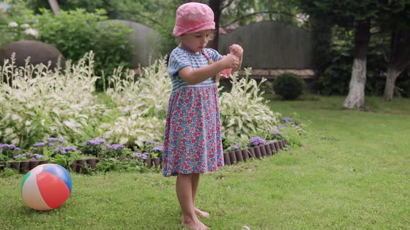 Happy Cute Children Blowing Soap Bubbles