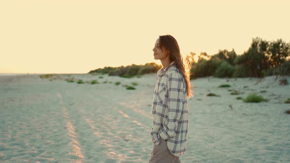 Happy Beautiful Mixed Race Woman Hipster Enjoying Walk on Wild Sea Sand Beach at Sunset with