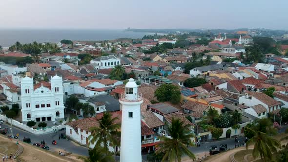 Aerial drone of Galle fort Lighthouse at sunset golden hour. Galle Dutch Fort, Sri lanka