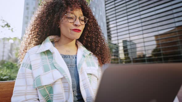 Young African American Woman is Having Online Meeting Using Her Laptop Businesswoman with Digital