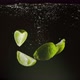 Lime Wedges Dropped Into Water - VideoHive Item for Sale