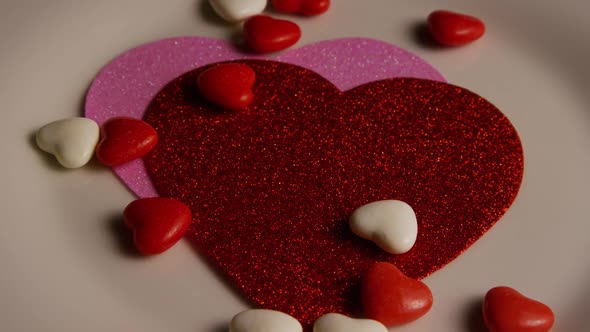 Rotating stock footage shot of Valentines decorations and candies - VALENTINES 0100