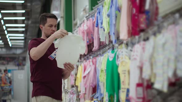 Man Buying Baby Bodysuit