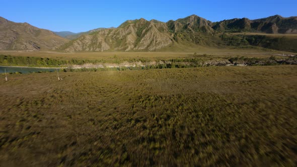 FPV Sports Drone Shot Flight Shadow Cliff Stone Texture Dry Grass Yellow Meadow Dirt Road Landscape