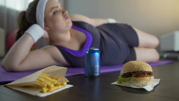 Obese Unmotivated Lazy Girl Chewing Fastfood, Living Unhealthy Lifestyle