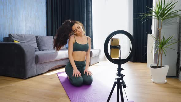 Fitness Blogger Recording Exercises for Home Training