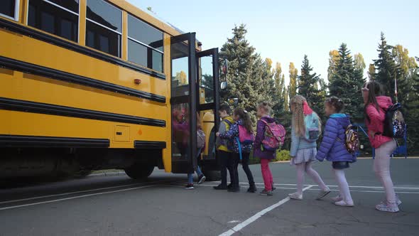 Elementary Age Students Entering School Bus