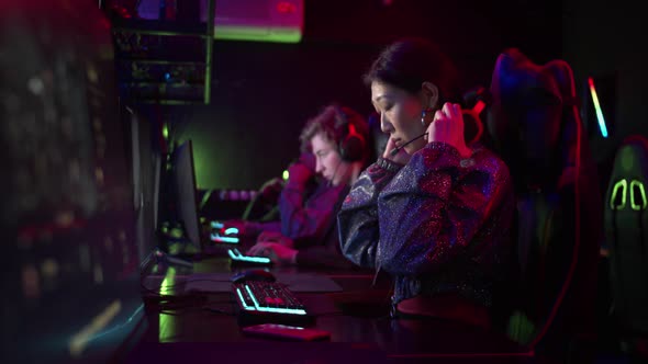 In the Evening There are Always a Lot of Students in the Computer Club the Girl Puts on a Headset