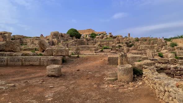 Moving scenery of tourists at Selinunte archaeological park in Sicily, Italy. Slow motion