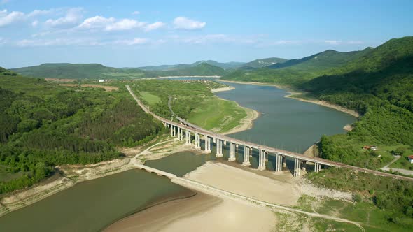 Picturesque valley with a drying dam and bridges