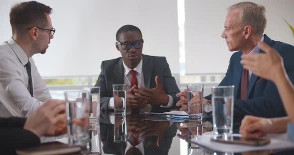 Group of Confident Business People Discussing Project Working Together in Office