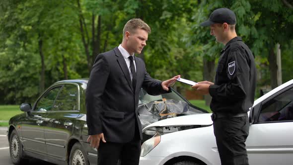 Rich Driver Giving Big Sum of Money to Insurance Company Worker to Avoid Fine