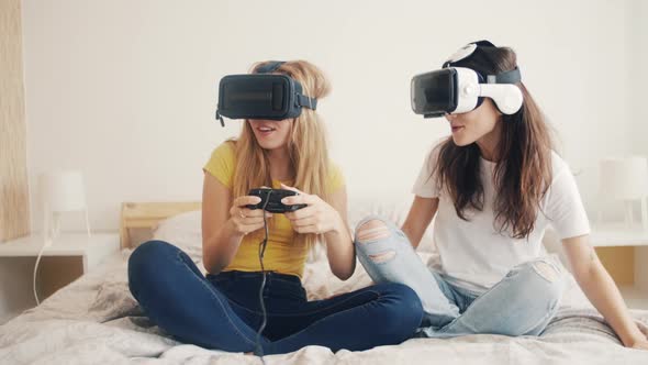 Exited Girls in VR Helmets at Home