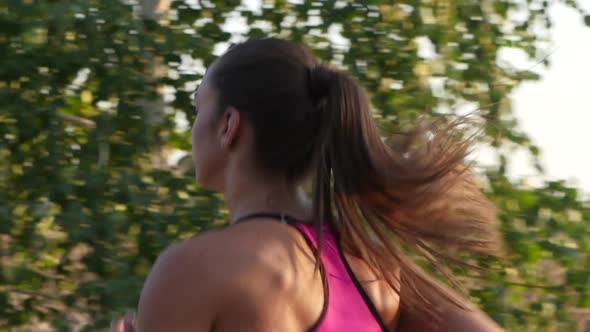 Brunette Athlete Trains in the Race. Slow Motion
