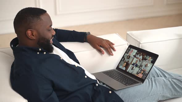AfricanAmerican Guy is Using Computer App for Video Meeting Online Conference