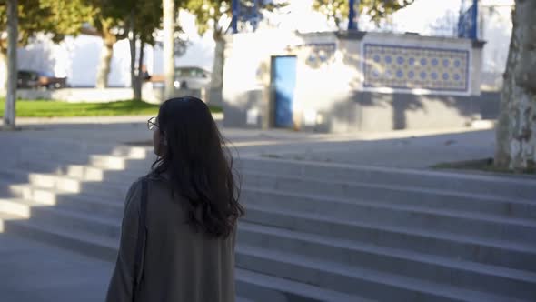 Caucasian woman walking in slow motion in Arraiolos traditional village streets in Alentejo