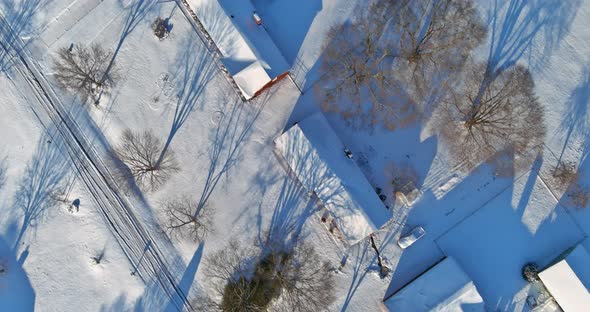 Blizzard Covers Roofs and Asphalt Roads Leading Through Tranquil Suburbs the Snow Covered Streets