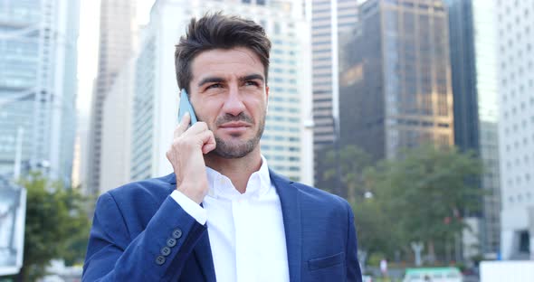 Businessman talk to cellphone at outdoor