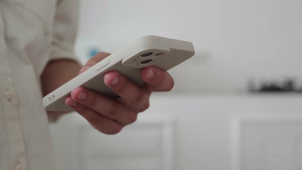 Unrecognizable Woman Using Her Smartphone