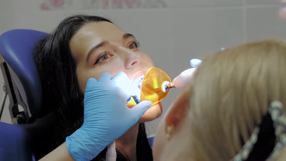 Dentist Doing a Dental Treatment on a Female Patient