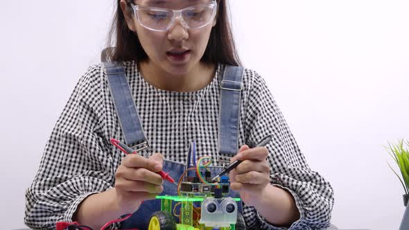 Robotics Engineers or student testing a robot. Innovative technology mechanical