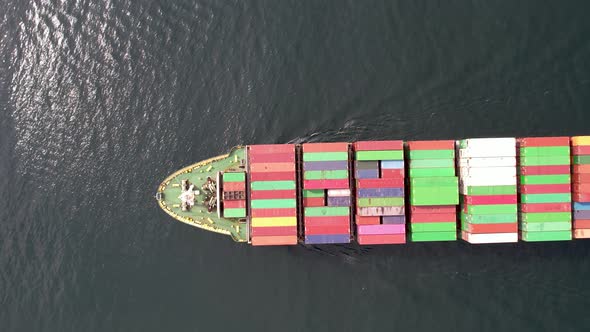 Large container ship at sea. Top down view.