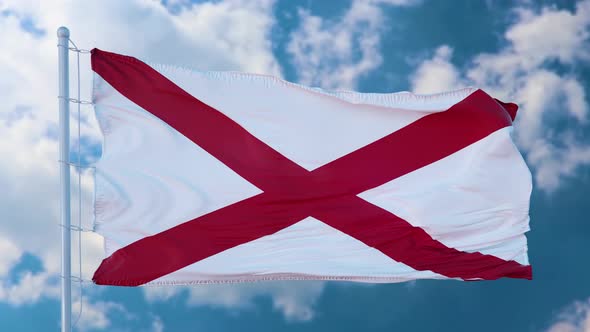 Flag of Alabama State Region of the United States Waving at Wind