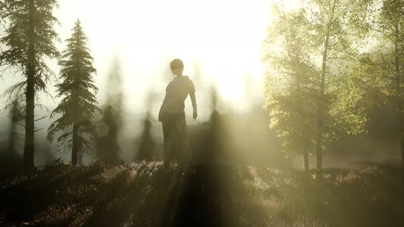 Young Woman Standing Alone Outdoor with Wild Forest Mountains alt