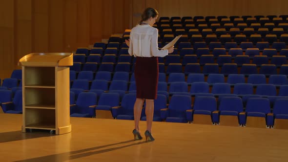 Young Caucasian businesswoman practicing speech in empty auditorium 4k