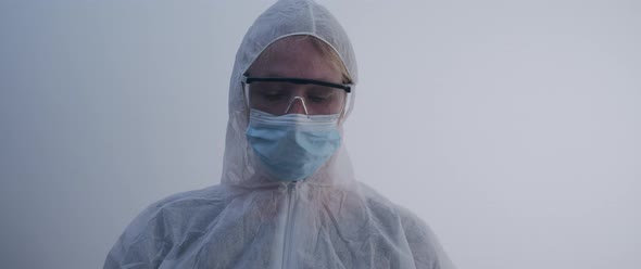 Woman Woman in protection gear looking up to the camera slow motion