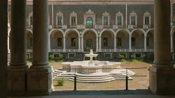 CATANIA, SICILY, ITALY - SEPT, 2019: Courtyard in the Center of Palace with the Fountain in Italy