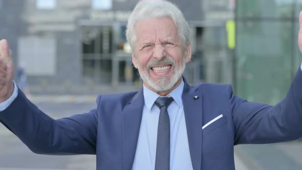 Excited Old Businessman Celebrating Success Outdoor