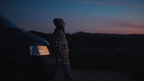 Soft Blurry Focus on Dreamy Girl Looks at Sunset