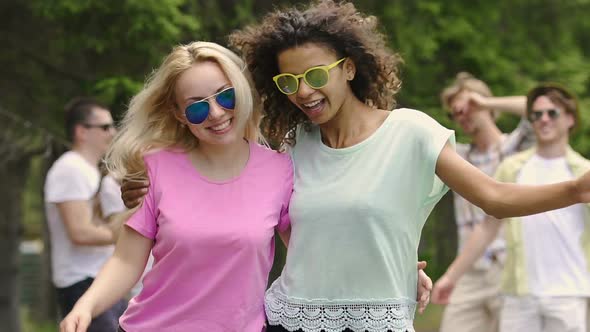 Pretty Multiethnic Girls Having Fun and Dancing With Friends at Music Festival