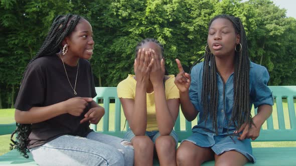 Stressed Cute Black Teenage Girls Arguing Over Something in Park