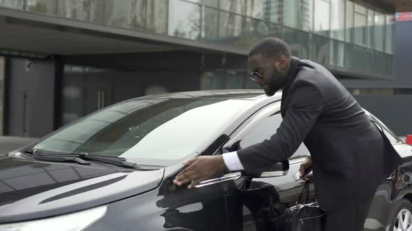 Pedantic and Scrupulous Man Noticing Dust on His Car and Coming Into Rage