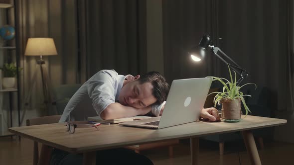 Asia Businessman Sleeping While Working From Home At Living Room At Night