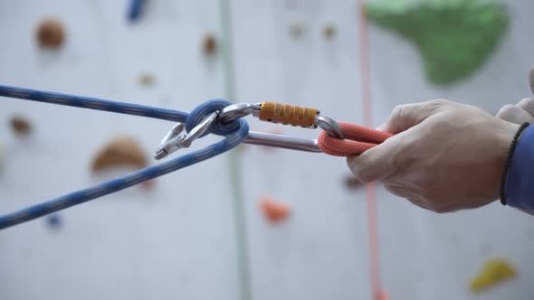 Climber Setting Rope, Belay Line with Karabiner for Indoors Climbing Session on Artificial Wall