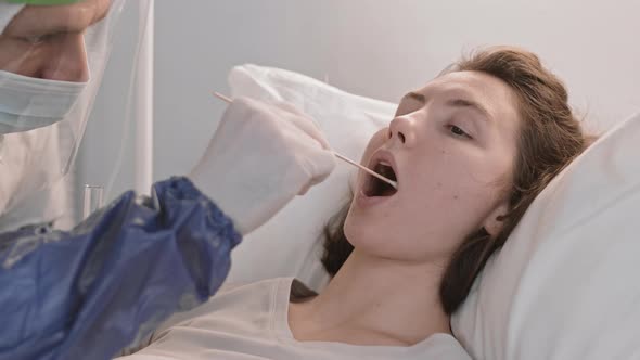 Doctor Taking DNA Sample from Patient