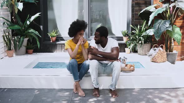 black couple conversating outdoor