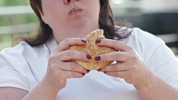 Woman Eating Burger