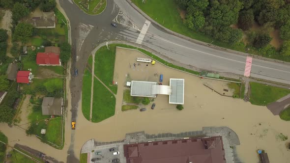 Top View of Flooded Intersection and Gas Station. The City During a Large-scale Flood. Aerial View