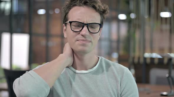 Portrait Shoot of Tired Young Guy Having Neck Pain