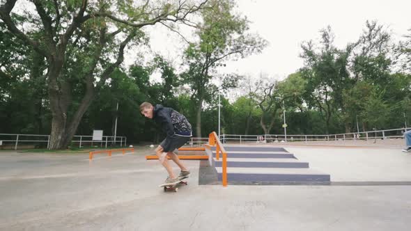 Skateboarder in Skate Park Doing Tricks Slow Motion