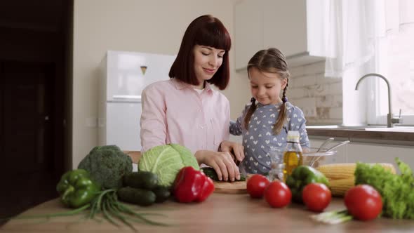 Caucasian Mother Teach Little Preschooler Daughter Chop Vegetables Preparing Salad for Lunch