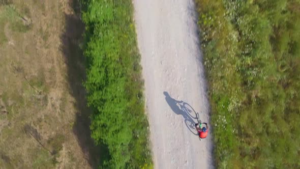 Man cycling with mountain bike on countryside road