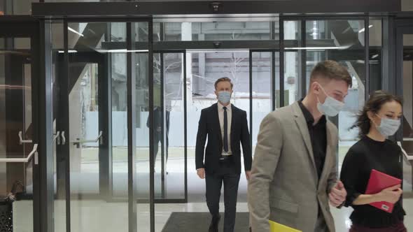 Business People Entering in the Business Building People are Wearing Mask